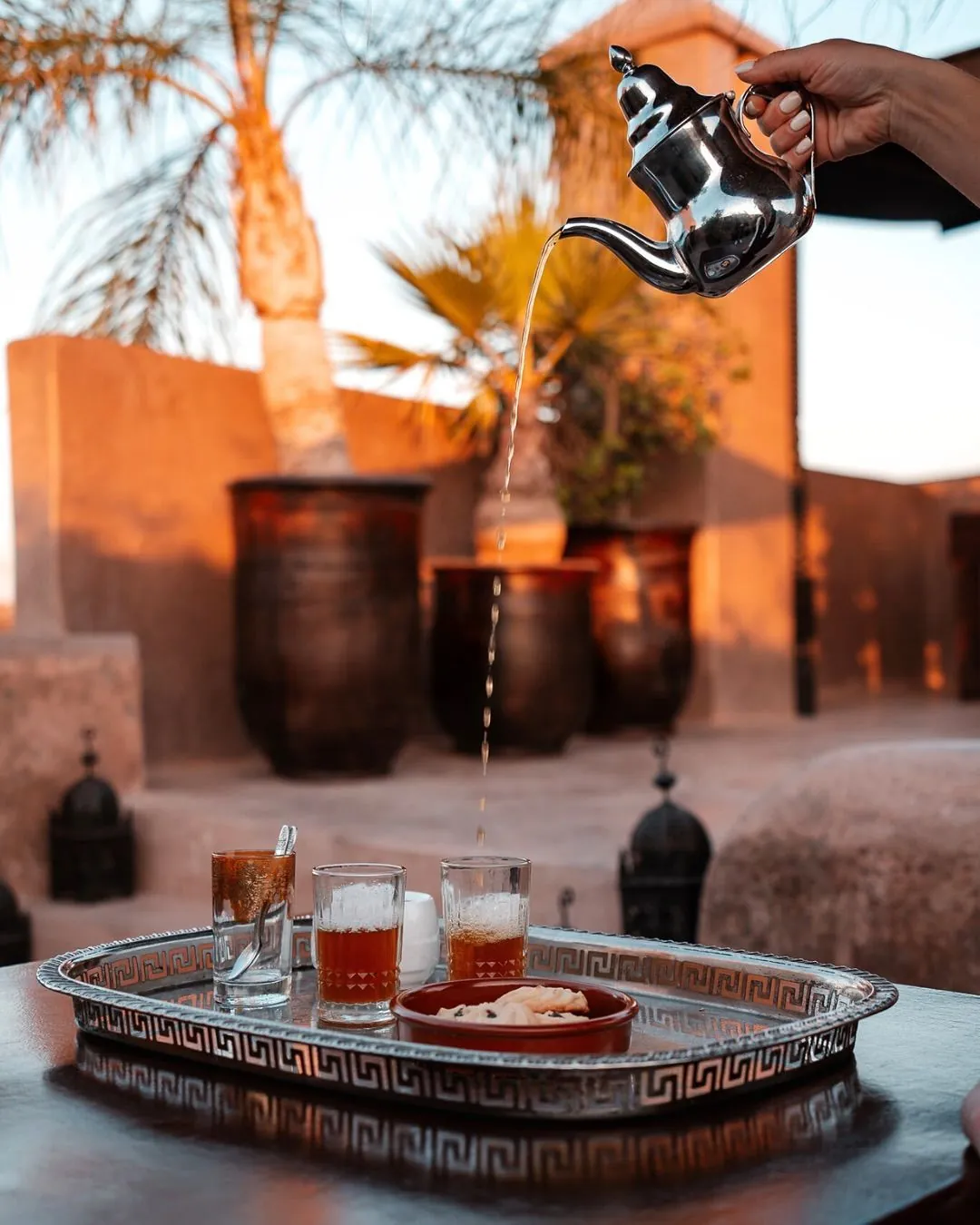 Mint tea poured on a rooftop at golden hour