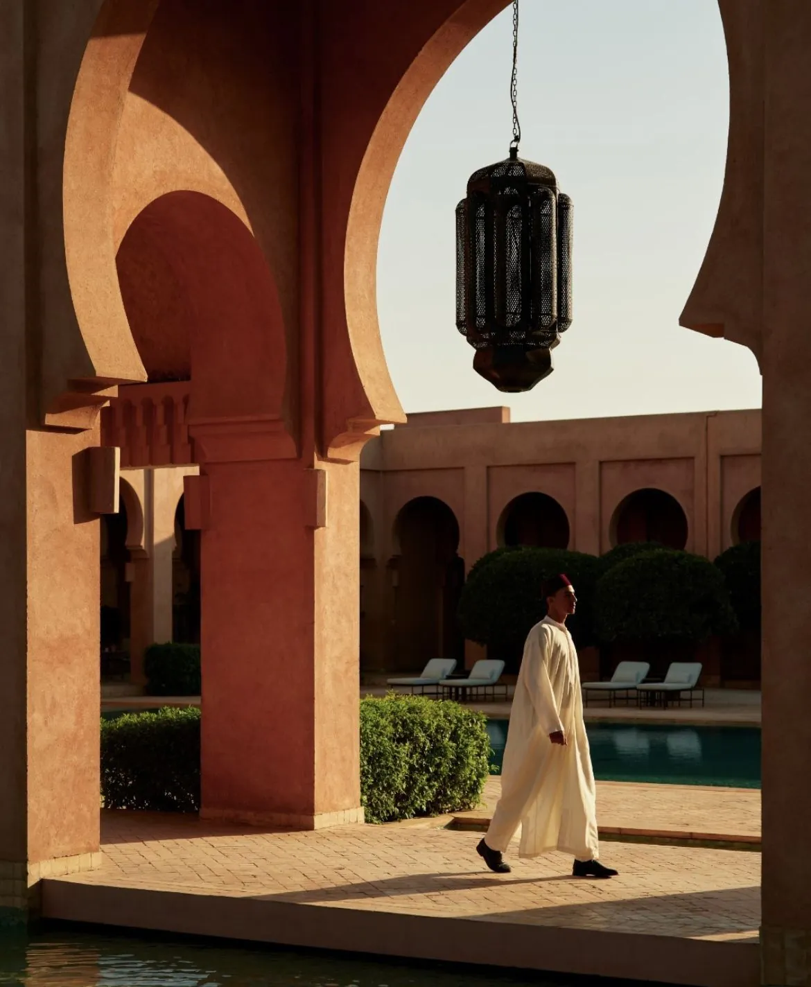 Carved plaster and a brass lantern in warm light